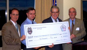 At the banquet, Retired Police Captain Kevin Reardon, Chair of the Police Officers 9/11 Fund (right) and Acting Police Chief Jay Farr (second from left)  present Jim Pebley, Chair of the ACCF 911 Scholarship Committee (second from right) a copy of the contribution check.